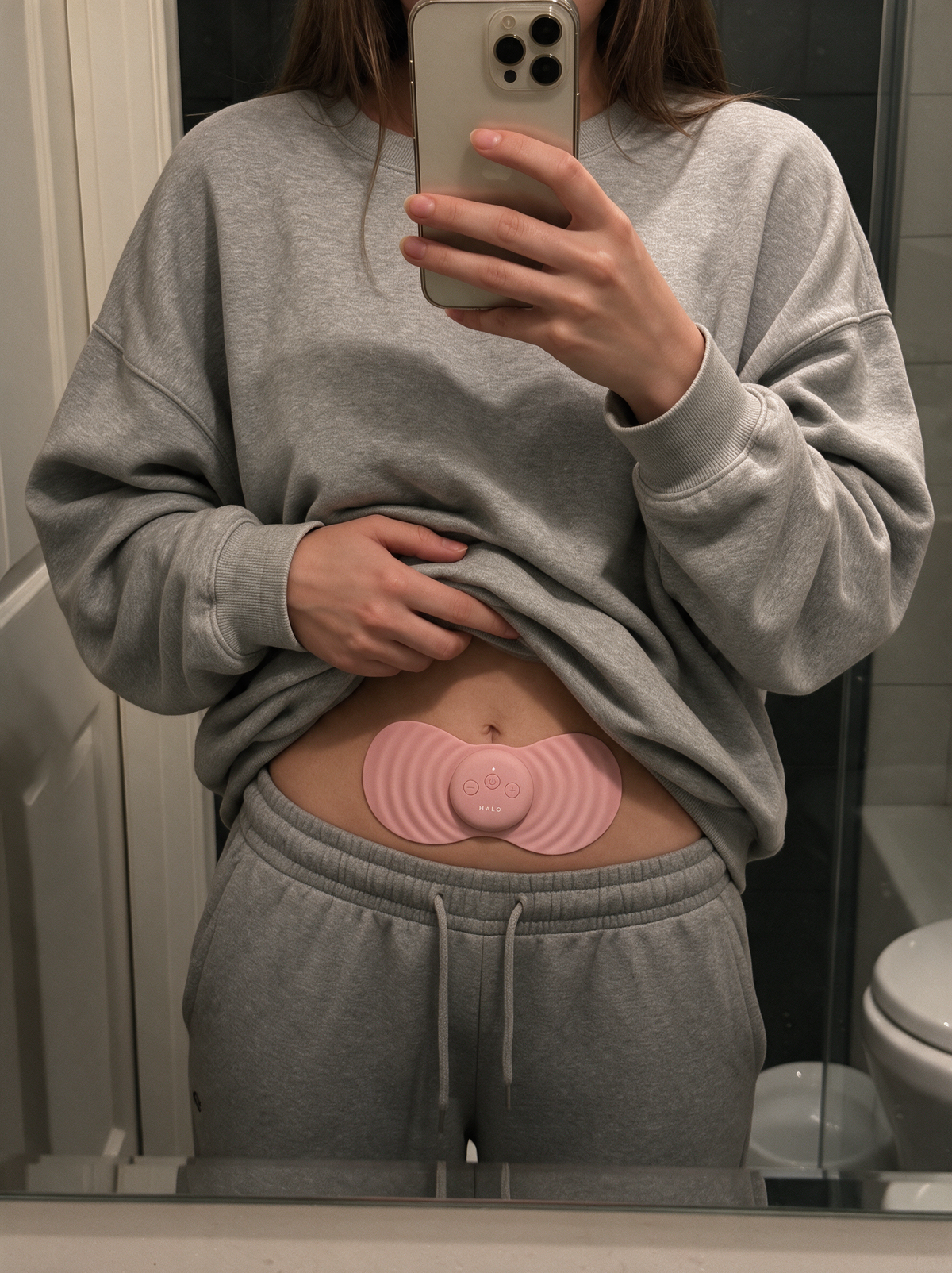 HALO worn on the lower belly, mirror selfie
